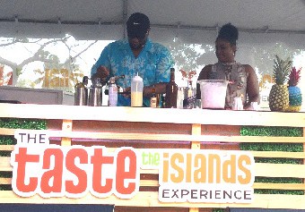 Bahamian Mixologist Marv Cunningham prepares demonstration of drink for onlookers at Taste the Islands Experience in Ft. Lauderdale.