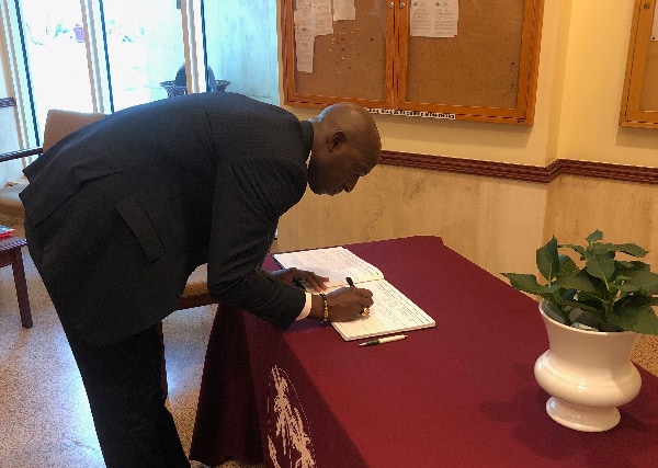 Miramar Mayor, Wayne Messam signing the Condolence Book in honour of former Jamaican Prime Minister, the late Most Hon. Edward Seaga, ON., PC.