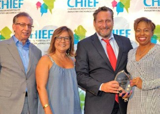 Wyb Meijer (second from right) is the 2019 Caribbean Association Executive of the Year. From left is Frank Comito, CHTA's Director General and CEO; Patricia Affonso-Dass, CHTA's President; and Stacy Cox, President of the Caribbean Society of Hotel Association Executives (CSHAE).