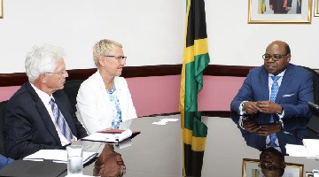 Minister of Tourism, Hon Edmund Bartlett (R) in discussion with Head of the Delegation of the European Union to Jamaica, Ambassador Malgorzata Wasilewska (C) and His Excellency Dr. Bernd von Muenchow-Pohl, Ambassador of Germany at the start of a meeting with several key representatives of the EU to Jamaica
