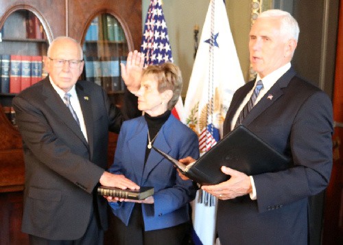U.S. Vice President Mike Pence (right) administers the oath of office to the newly appointed Ambassador of the U.S. to Jamaica Donald R Tapia 