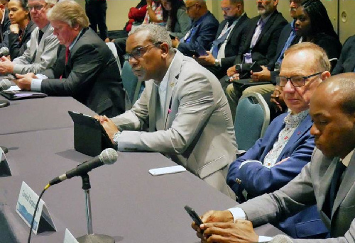 Governor Albert Bryan Jr. (center) listens attentively to cruise line executives in San Juan last week.