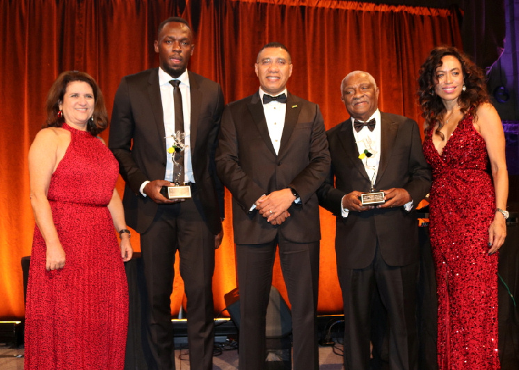 New York based American Friends of Jamaica award grants to 33 charities in Jamaica Wendy Hart, Usain Bolt, Glenford Christian, Caron Chung