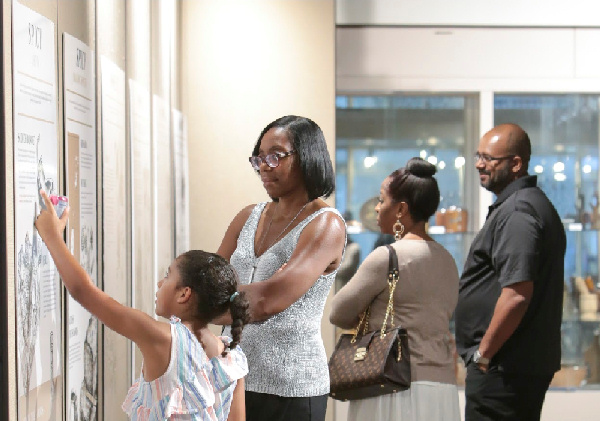 Attendees of multiple generations learn about the food history of the Caribbean at the June African American Research Library and Cultural Center installation of the Caribbean Culinary Museum