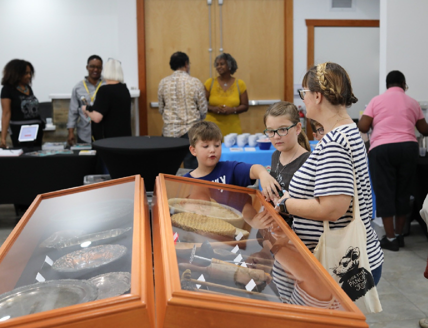 Guests observe the Caribbean Culinary Museum at Bailey Contemporary Arts in Pompano Beach