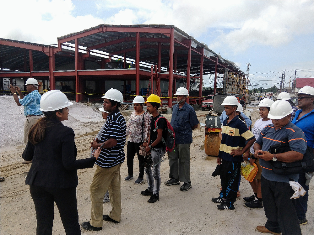 Guyana Farmers visiting the new TOPCO plant under construction.