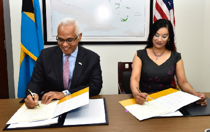 The Minister of Tourism, Hon. Dionisio D'Aguilar and Ms. Manisha Singh, US Assistant Secretary of State, Bureau of Economic and Business Affairs signing the Air Transport Agreement 