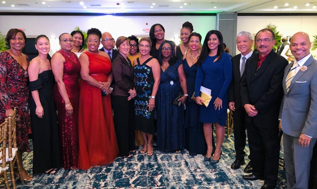 Kevin Hendrickson (third from right) is joined by Courtleigh Hospitality Group staff and family members in celebrating his AMCHAM Jamaica President’s Award.