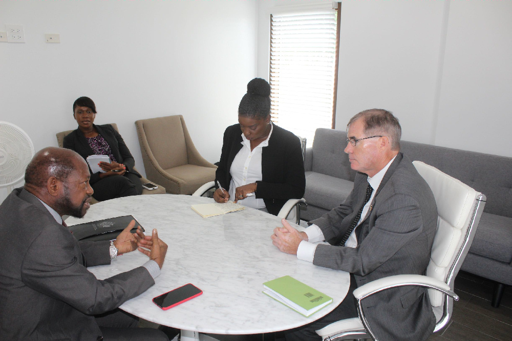St Kitts and Nevis' Leader of the Opposition, the Right Hon Dr Denzil L. Douglas (left), Mrs Amelia Swift (center at the table) and Mr Mike Pennell 
