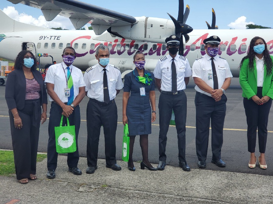 Dominica Minister of Tourism, The Honourable Denise Charles with Caribbean Airlines crew.