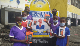 Jamaican students receive Computer devices donated by the Diaspora - Rock Hall All Age - Jamaica