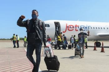 Passengers disembark Jet Air Caribbean at the Norman Manley International Airport
