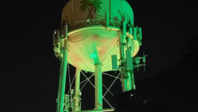 Historic Miramar Water Tower lit up in Jamaica Colors