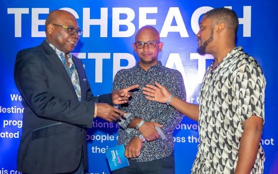Minister of Tourism, Hon Edmund Bartlett (left) shares a cordial moment with co-founders of Tech Beach, Kirk Anthony Hamilton (centre) of Jamaica and Trinidadian Kyle Maloney.