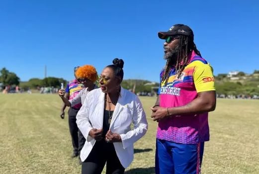 Minister Babsy Grange and Chris Gayle
