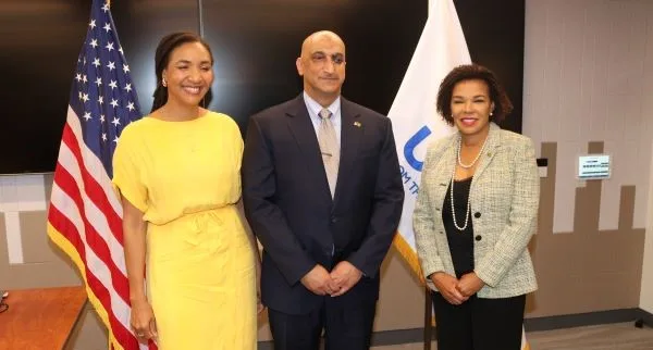 Jamaica’s Ambassador to the United States Audrey Marks at right and Deputy Administrator for the USAID Ms Polomola Adams-Allenat left shares the spotlight with new USAID Country representative for Jamaica, Dr. Jay Singh, (center) at his swearing in ceremony.