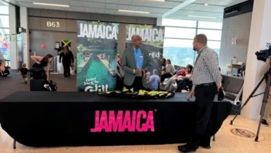 Christopher Wright, Business Development Officer, Jamaica Tourist Board at the gate for the Southwest inaugural flight from Kansas City International Airport to Montego Bay.
