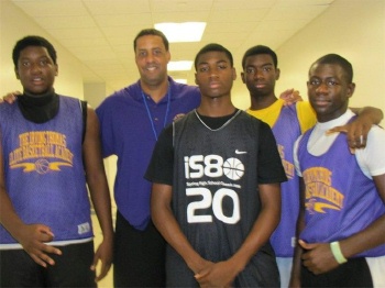 Irving Thomas 2nd from right with past students of Elite Basketball Academy